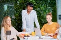 Beautiful african business coach speaking at diverse corporate group meeting Royalty Free Stock Photo