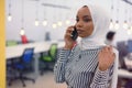 Beautiful african corporate worker talking on mobile phone. Happy african american career woman using cell phone Royalty Free Stock Photo