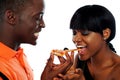 Beautiful african couple eating pizza