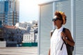 Beautiful african girl smiling walking down city. Fashion street style. Royalty Free Stock Photo