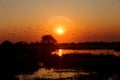 Beautiful african sunrise reflected on lake