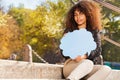 Beautiful African teenage girl with speech cloud Royalty Free Stock Photo