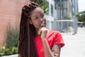 Beautiful african woman with dreadlocks in the city Royalty Free Stock Photo