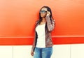 Beautiful african woman wearing a leather jacket and sunglasses Royalty Free Stock Photo