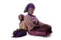 Beautiful African woman and lovely little girl sitting on floor