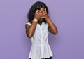 Beautiful african young woman wearing casual clothes with sad expression covering face with hands while crying Royalty Free Stock Photo