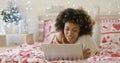 Beautiful Afro American girl lying on bed Royalty Free Stock Photo