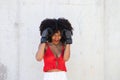 Beautiful Afro-American woman with boxing gloves claiming women`s rights against mistreatment and breast cancer. Concept of women