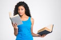 Beautiful afro american woman holding two books Royalty Free Stock Photo