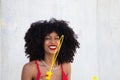 Beautiful afro american woman making soap bubbles in the park. The woman is having a great time with the bubbles and that`s why Royalty Free Stock Photo