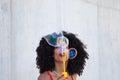 Beautiful afro american woman making soap bubbles in the park. The woman is having a great time with the bubbles and that`s why Royalty Free Stock Photo