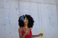 Beautiful afro american woman making soap bubbles in the park. The woman is having a great time with the bubbles and that`s why Royalty Free Stock Photo