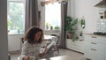 Beautiful Afro American woman reading book at home. Royalty Free Stock Photo