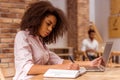 Beautiful Afro-American woman working