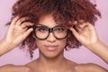 Afro girl in eyeglasses, smiling. Royalty Free Stock Photo