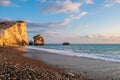 Beautiful afternoon view of the beach around Petra tou Romiou, also known as Aphrodite`s birthplace, in Paphos, Cyprus. A boy Royalty Free Stock Photo