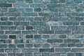 Beautiful aged and weathered blue brick wall surfaces in a close up view Royalty Free Stock Photo