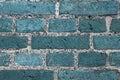 Beautiful aged and weathered blue brick wall surfaces in a close up view Royalty Free Stock Photo