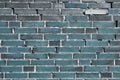 Beautiful aged and weathered blue brick wall surfaces in a close up view Royalty Free Stock Photo