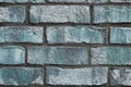 Beautiful aged and weathered blue brick wall surfaces in a close up view Royalty Free Stock Photo