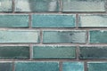 Beautiful aged and weathered blue brick wall surfaces in a close up view Royalty Free Stock Photo