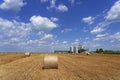 Beautiful Agricultural Landscape Scenery With Hay Bales and Grain Silos Royalty Free Stock Photo