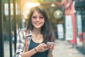 Beautiful aisan woman toothy smiling face with smart phone in ha Royalty Free Stock Photo