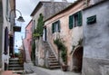 Beautiful alley through vintage houses in Capoliveri, Italy