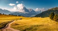 Beautiful alpine countryside. Awesome Alpine landscape in sunny day. Amazing Nature Scenery of Dolomites Alps. Epic Scene in the Royalty Free Stock Photo