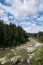 Beautiful alpine landscape, mountains scenery, sky blue clouds. Travel background. Summer panoramic view. Mountain hiking. Forest Royalty Free Stock Photo