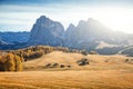 Beautiful alpine landscape with wooden chalets on scenic Alpe di Siusi Royalty Free Stock Photo