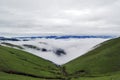 Beautiful alpine meadows, clouds and mists in the mountains, like fairyland Royalty Free Stock Photo