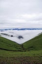 Beautiful alpine meadows, clouds and mists in the mountains, like fairyland Royalty Free Stock Photo