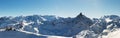 Beautiful alpine panoramic view snow capped mountains. Winter mountain scenery Royalty Free Stock Photo