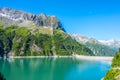 Beautiful alpine walley with azure blue water dam Royalty Free Stock Photo