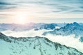 Beautiful Alps mountains with clouds at sunset Royalty Free Stock Photo