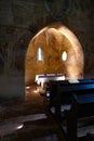 Beautiful altar in a little old natural light church with fresco