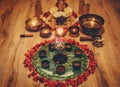 Beautiful altar with rose petals and incense. Cacao ceremony space.