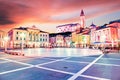 Beautiful amazing city scenery in the central square with the old clock tower in Piran, the tourist center of Slovenia in the