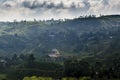 Beautiful amazing landscape view of the tea plantations near small village surrounded by mountains Royalty Free Stock Photo