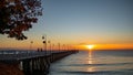 Beautiful and amazing sunrise on the pier at the seaside, Gdynia. Royalty Free Stock Photo