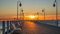 Beautiful and amazing sunrise on the pier at the seaside, Gdynia. Royalty Free Stock Photo