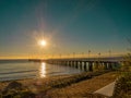 Beautiful and amazing sunrise on the pier at the seaside, Gdynia. Royalty Free Stock Photo