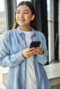 beautiful and ambitious asian businesswoman holding