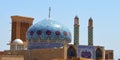 Beautiful ancient designs and azure tiles on the dome and minarets of a mosque in Yazd, Iran