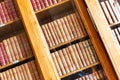 Beautiful ancient old books on shelf in the library Royalty Free Stock Photo