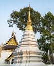 White pagoda at sunset,and huge trees beyond,Wat Chedi Luang,Buddhist temple,Chiang Mai, Thailand Royalty Free Stock Photo