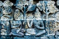 Beautiful ancient wall art relief with Buddha, Buddhist temple complex Borobudur, Yogyakarta, Jawa, Indonesia Royalty Free Stock Photo