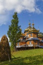 Ancient wooden  church on green hill. Ukrainian  Carpathians Royalty Free Stock Photo