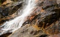 Beautiful Andahelena Ella waterfall close-up in Elpitiya, Sri Lanka. Water stream cascaded through wet mossy rocks Royalty Free Stock Photo